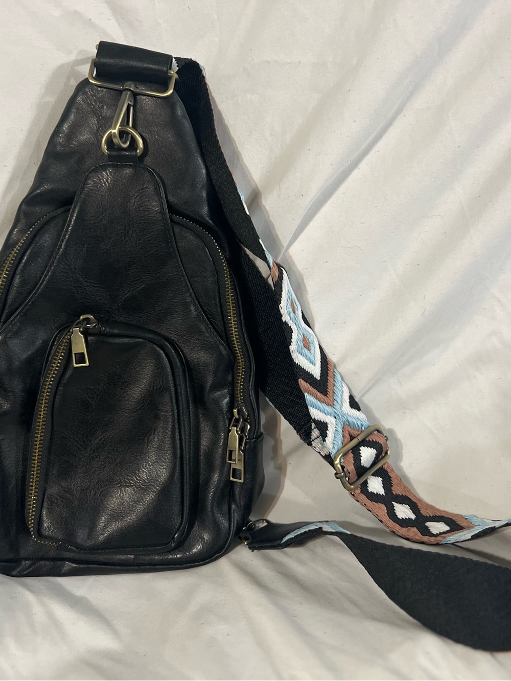 Black Leather Crossbody Sling Bag with Patterned Strap